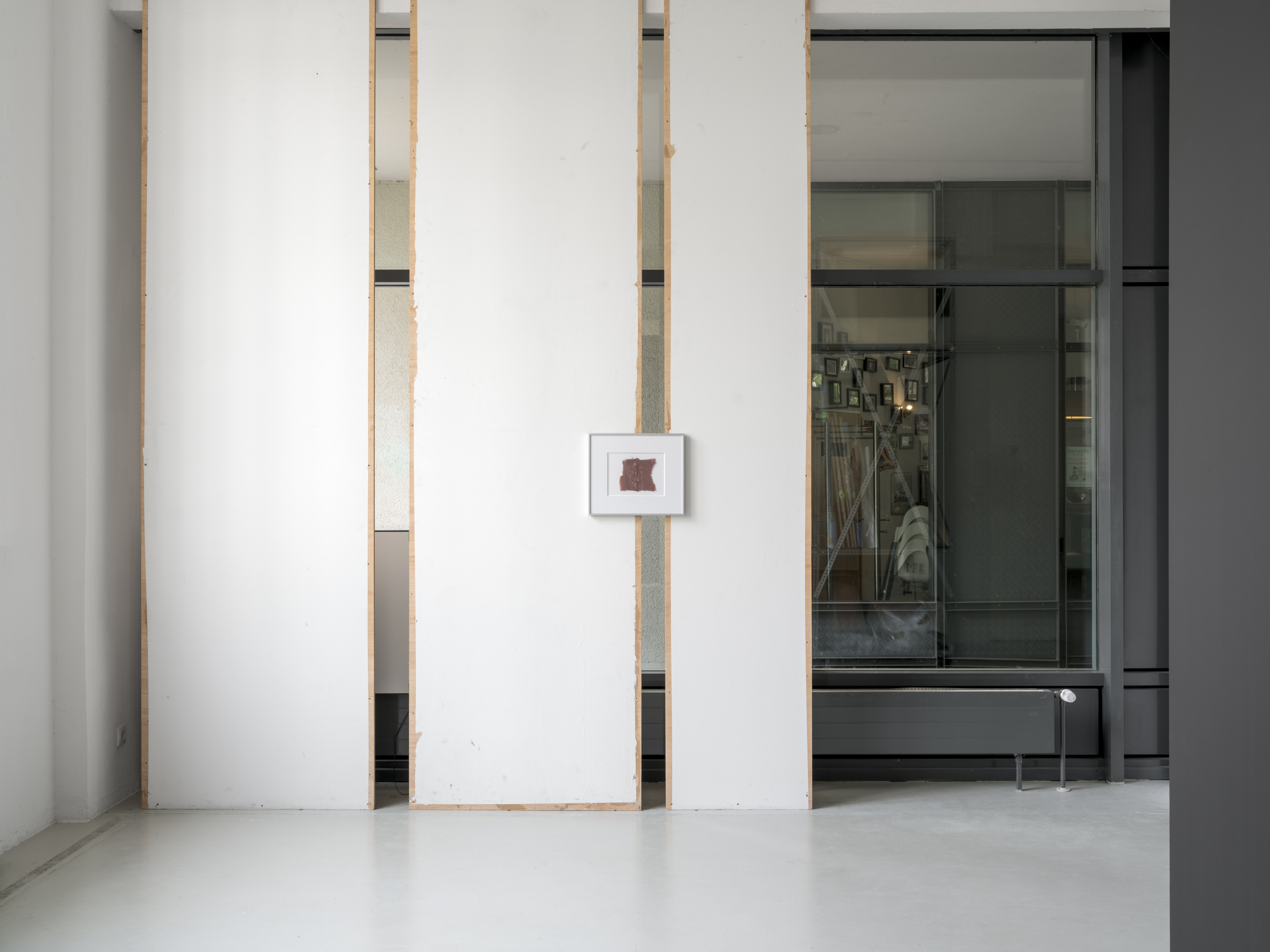 Aisha Altenhofen solo exhibition at Austin Space: Installation view of the grid light box installed across the window in the gallery space.